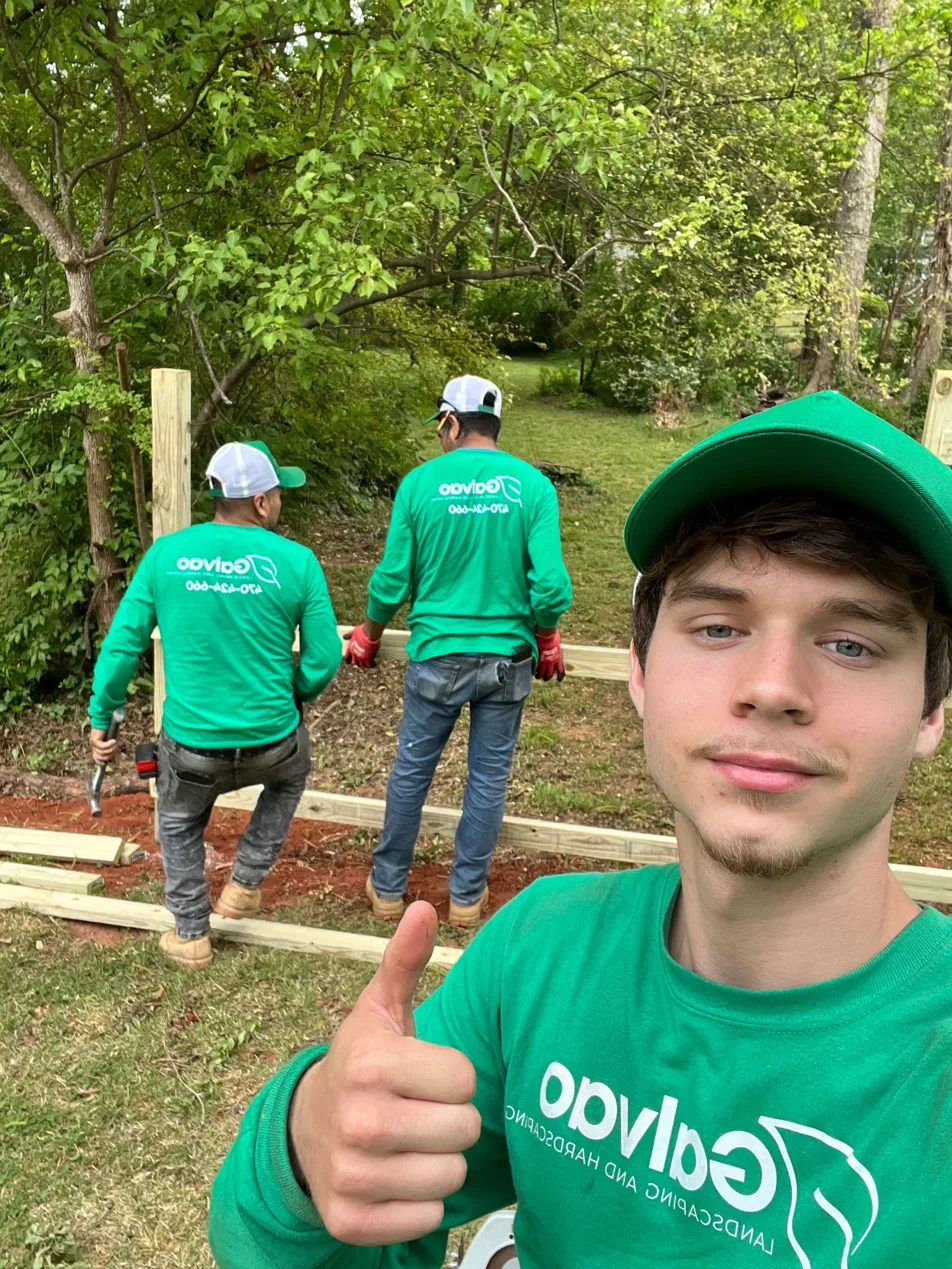 Owner of Galvao Landscaping in front of Atlanta home