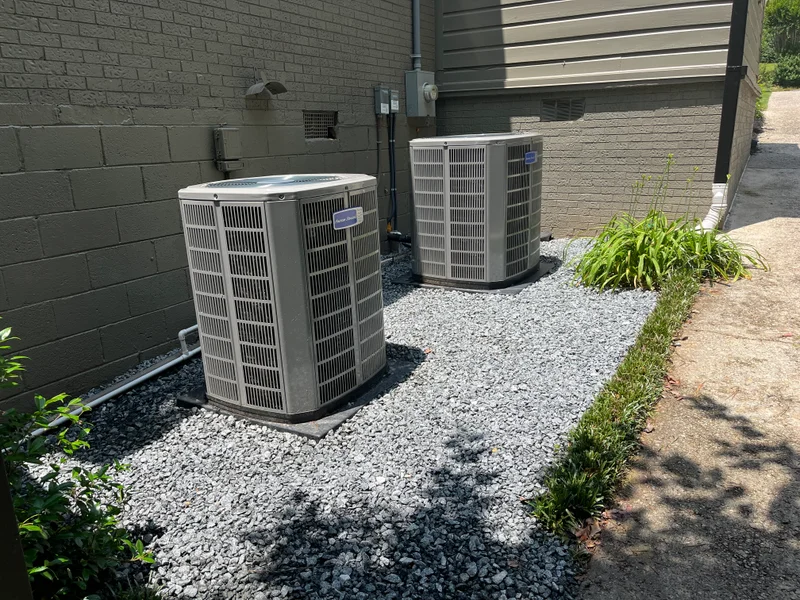 Fresh gray gravel base around outdoor condenser units