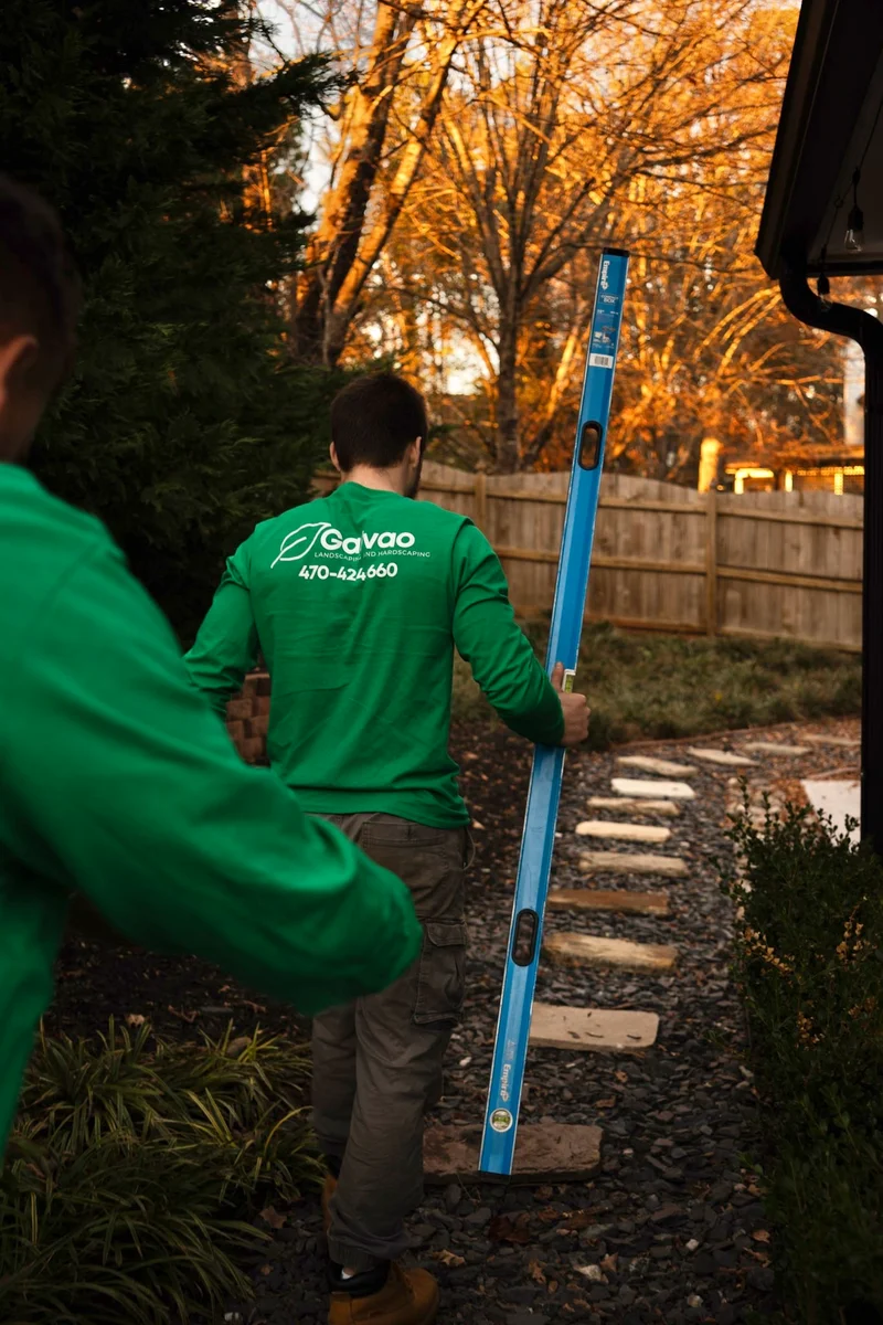 Galvao crew installing a flagstone path at sunset