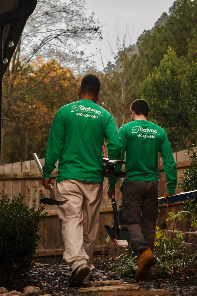 Galvao crew heading to a paver build with hand tools